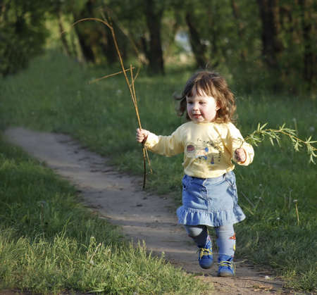 The running girl on a footpath (age 2 years) の写真素材