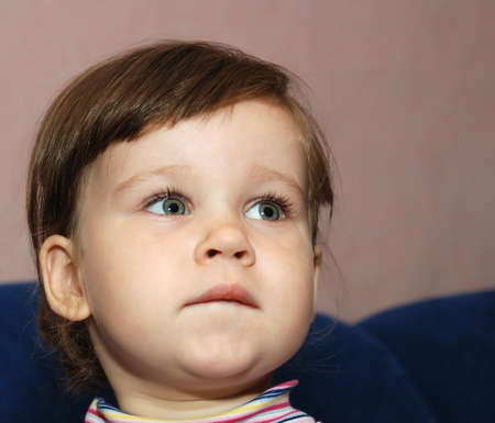 The sad child. The two-year-old girl in bad mood