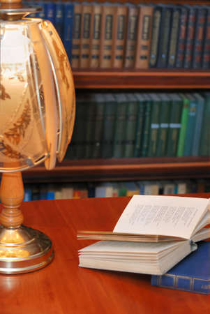 The book of verses under light of a desk lamp. A cosy atmosphereの写真素材