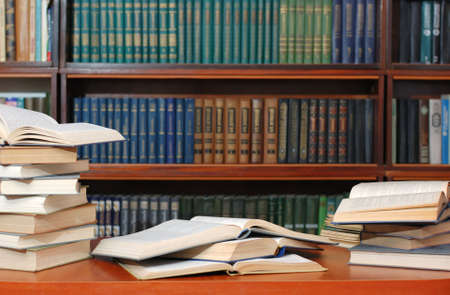 Books. Textbooks spread out to a table before examination