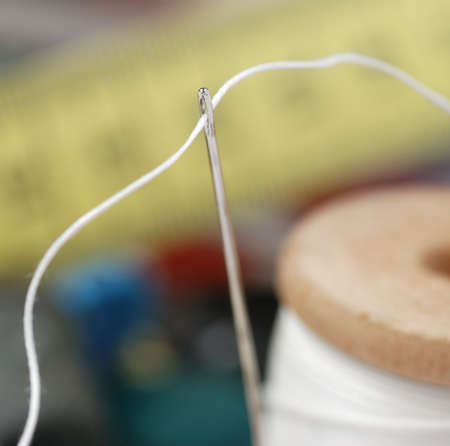 Needle and a thread. A set of accessories for sewing.