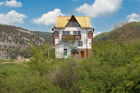 The house in a valley. Crimean mountains and a cottageの写真素材