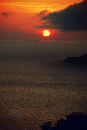 Sunset. A picturesque sunset with fantastic foggy under mountainの写真素材