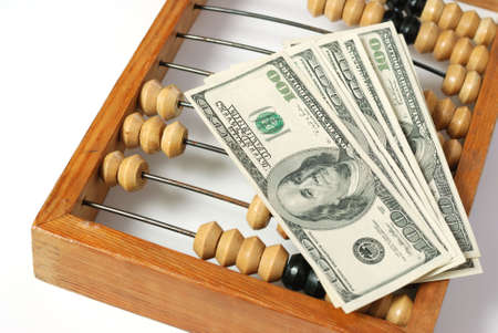 abacus and dollar. Old abacus symbolizing the last time and new dollars