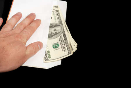 Bribe. Criminal activity, payoff. Money enclosed in an envelope