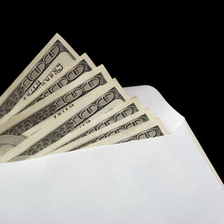 Bribe. Criminal activity, payoff. Money enclosed in an envelopeの写真素材