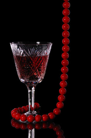 Wine. A glass vessel with wine, a red grape drinkの写真素材