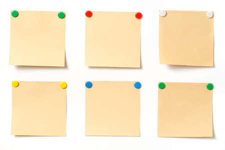 note. Paper a note attached to a wall buttons, it is isolated on a white backgroundの写真素材