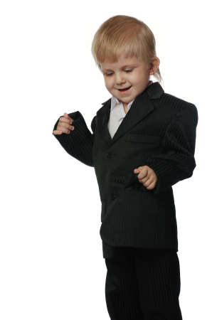 The boy in a suit. It is isolated on a white background. Age 3 yearsの写真素材