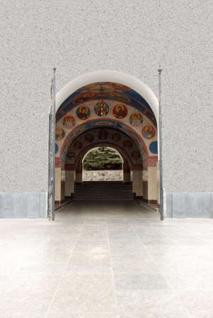 Arch gateway in church. The paved way to a white buildingの写真素材