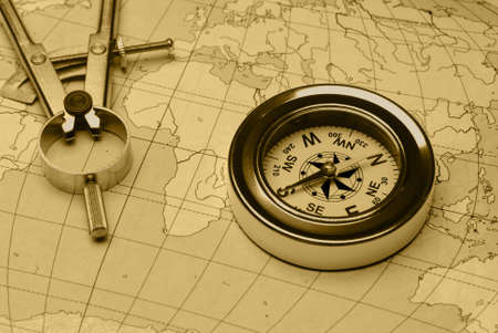 Ancient compass. The old device for the instruction of a direction and an old card
