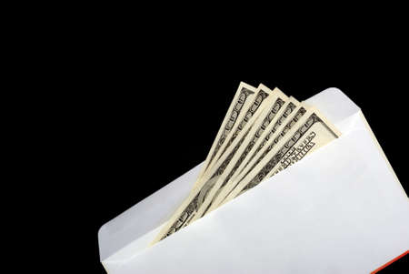 Bribe. Criminal activity, payoff. Money enclosed in an envelopeの写真素材