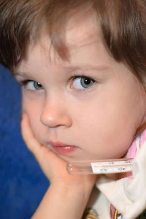 The girl with a thermometer. A portrait close up