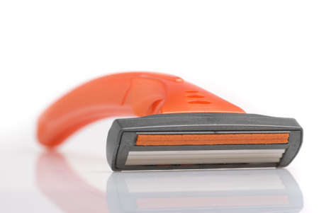 The disposable razor. The shaving machine tool isolated on a white backgroundの写真素材