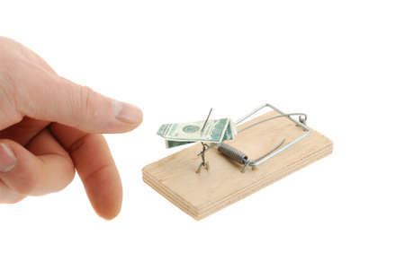 Mousetrap with dollar and hand. The adaptation for catching mice and other fine rodentsの写真素材