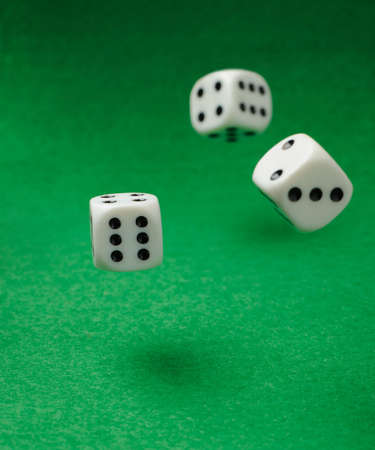 motion dices. Game cubes on a green backgroundの写真素材