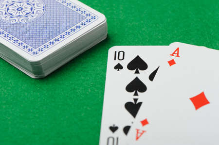 blackjack.Playing cards on a green background. Poker cardsのeditorial素材