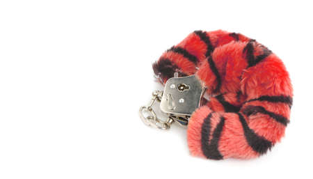 Handcuffs for ual joys. Iron handcuffs isolated on a white backgroundの写真素材