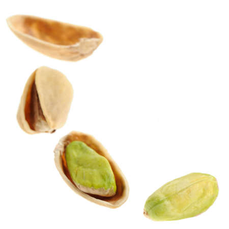 Pistachioes. Nuts it is isolated on a white backgroundの写真素材