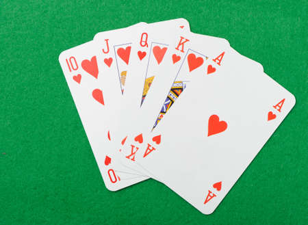 Playing cards on a green background. Poker cards