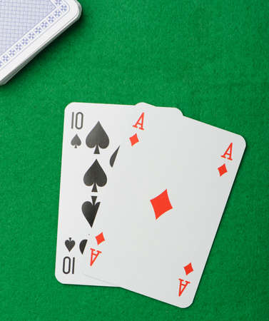 blackjack.Playing cards on a green background. Poker cardsのeditorial素材