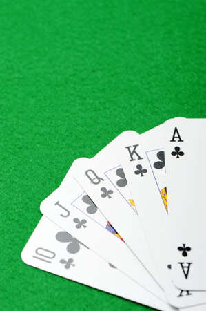 Playing cards on a green background. Poker cards