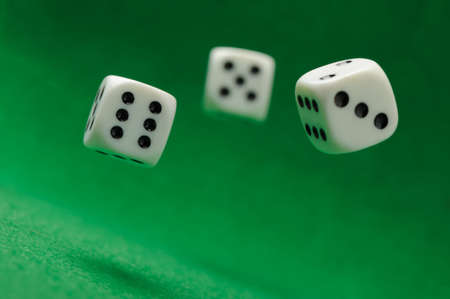 motion dices. Game cubes on a green backgroundの写真素材
