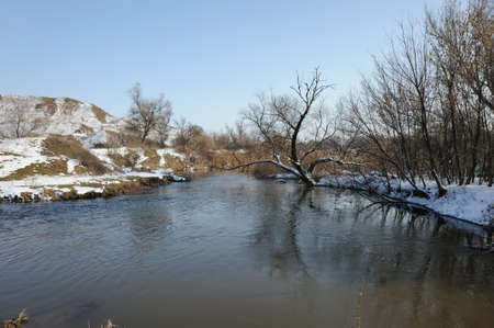 The spring river. A rough stream after a spring thawing weatherの写真素材