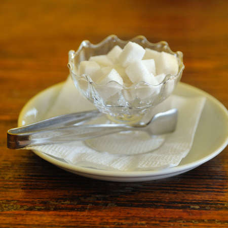 Sugar. The refined pieces of sugar in a glassの写真素材