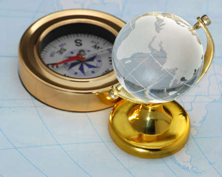 Compass and globe. The device for the instruction of a direction and a cardの写真素材