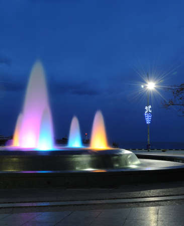 Color fountain. A night photo, light from street lanternsの写真素材