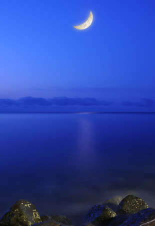 The moon and the sea. Coast of the black sea Crimea, Ukraineの写真素材