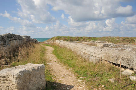 Road to the sea. A track among ruins of antique cityの写真素材