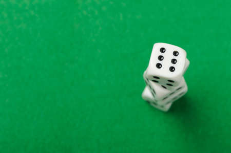dices. Game cubes on a green backgroundの写真素材