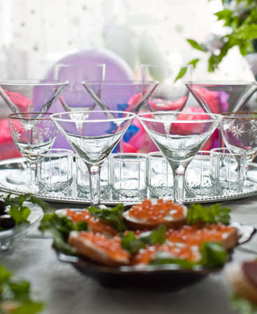 Buffet table. A table with glasses and easy snackの写真素材