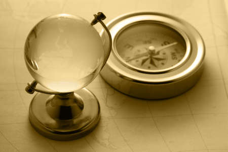 Ancient compass. The old device for the instruction of a direction and an old cardの写真素材