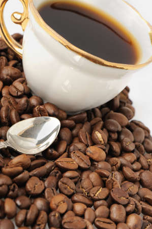 stylish coffee cup with silver spoon. A cup with a coffee drink. It is isolated on a white backgroundの写真素材