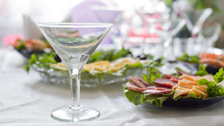 Buffet table. A table with glasses and easy snackの写真素材