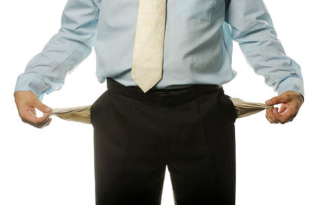 The young businessman with empty pockets. It is isolated on a white backgroundの写真素材