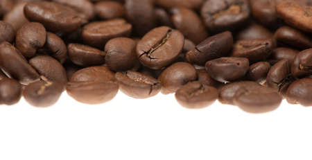 Heap of grains of coffee. It is isolated on a white backgroundの写真素材