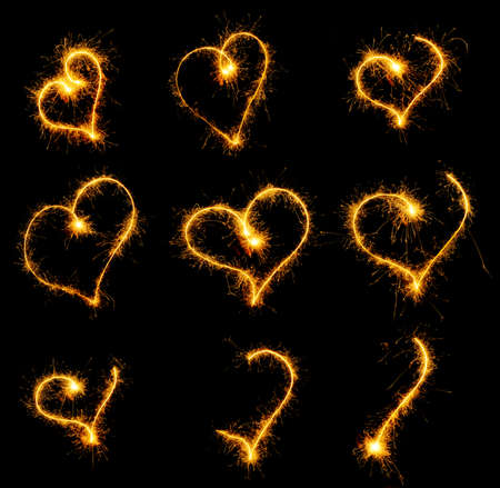 Heart from sparks. It is isolated on a black backgroundの写真素材