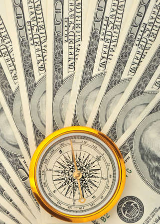 Dollars and compass. Concept about a direction in businessの写真素材