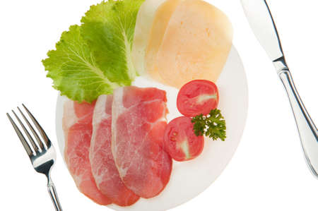 Meat cutting with vegetables and cheese. It is isolated on a white backgroundの写真素材