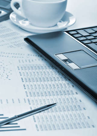 Workplace of the businessman. Laptop in an environment of financial calculationsの写真素材