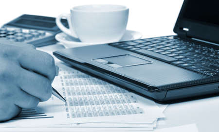 Workplace of the businessman. Laptop in an environment of financial calculationsの写真素材