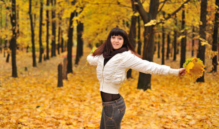 The girl in an autumn forest. The European appearanceの写真素材
