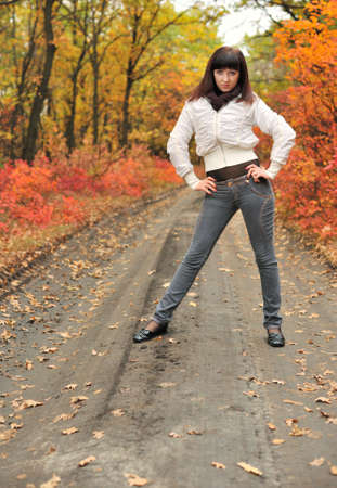 The girl in an autumn forest. The European appearanceの写真素材