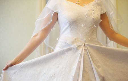 Wedding dress. A white dress of the bride close up