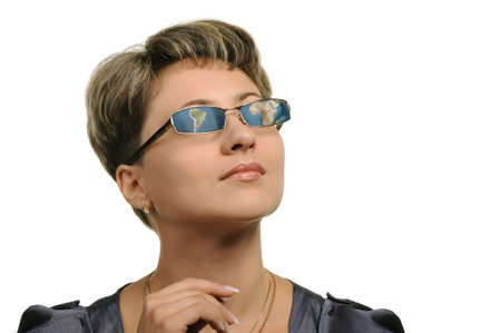 Sight at the world. The girl in glasses with reflection map world.の写真素材