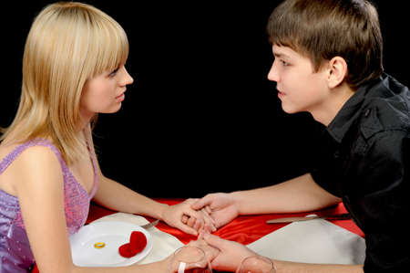 Romantic supper. Young the man proposal the offer to the girlの写真素材